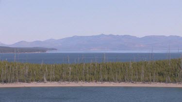 Rocky mountains, forest, and large pristine lake