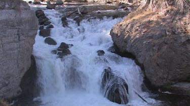 Cascading, mountainside waterfall in spring