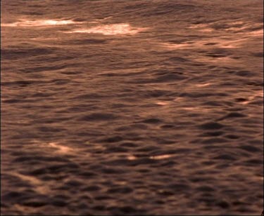Atmospheric Shot of Sunset Colours On Ocean Shoreline