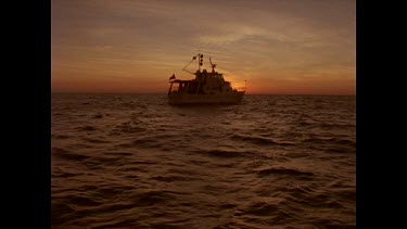 sunset behind Reef Explorer