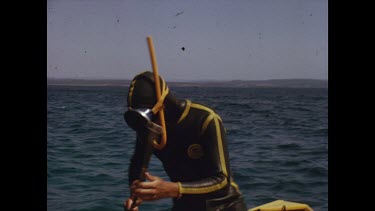 John Harding dives underwater