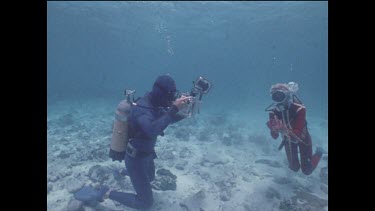 Ron Taylor filming Valerie holding Capricorn octopus