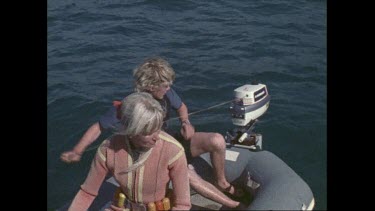 Valerie and boy take off on dinghy just out from Coalcliff