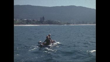 Valerie and boy take off on dinghy just out from Coalcliff