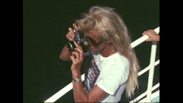 Valerie Taylor takes a photograph of illegal fishing boat