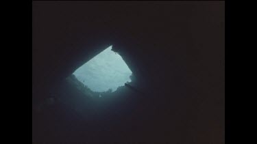 divers explore shipwreck