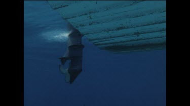 propeller of boat starts up and boat takes off