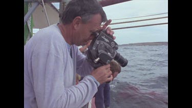 cameraman films feeding shark