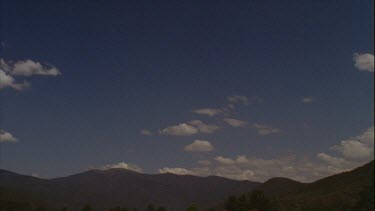 Timelapse of Boiling Clouds Over Mountains