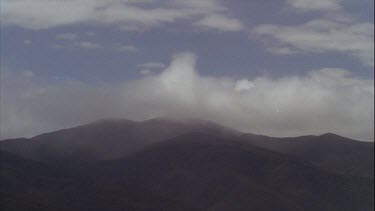 Timelapse of Boiling Clouds Over Mountains