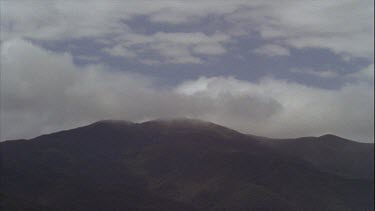 Timelapse of Boiling Clouds Over Mountains