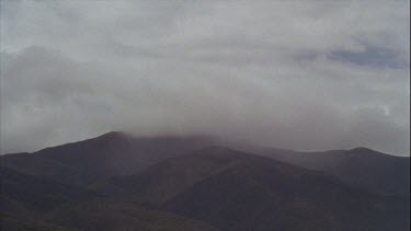 Timelapse of Boiling Clouds Over Mountains