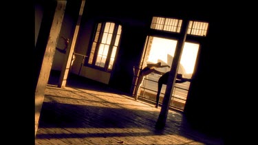 Sepia tones. Ballet dancers warming up at the barre, Sydney Opera House in background