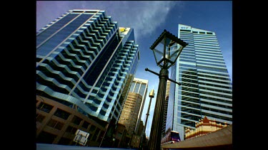 Low Angle. Monorail with Sydney city in background. Very tall buildings