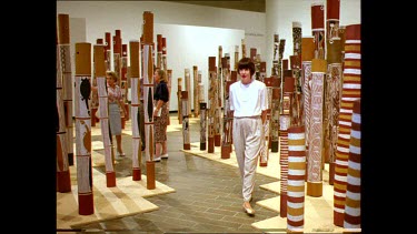 National Art Gallery Aboriginal totems. Visitors walking through display.