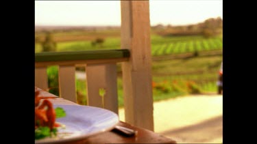 Waiter pours wine.