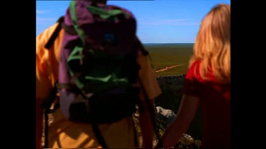 Couple Hiking along coastline