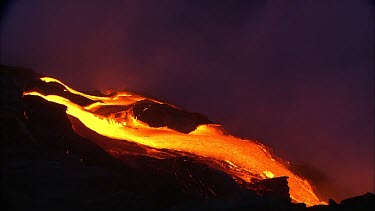 Volcano night. Lava flowing quickly. Bubbles bubbling.