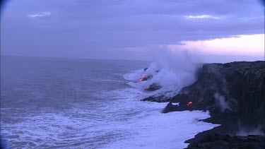 Establishing shot. Base of volcano beach, the waves crashing into the volcano and turning to steam. Birds flying. Incandescent lava. Sunrise. Daybreak.