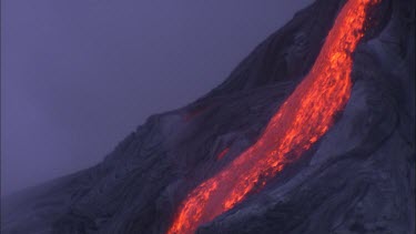 Steam and lava flow. Recently solidified lava crust