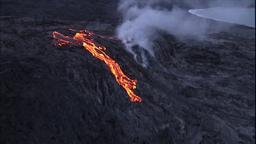 Steam and lava flow. Recently solidified lava crust