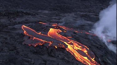 Steam and lava flow. Recently solidified lava crust