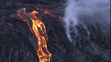 Steam and lava flow. Recently solidified lava crust