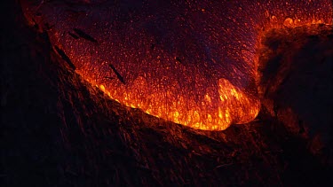 Incandescent lava seeping from a fissure.