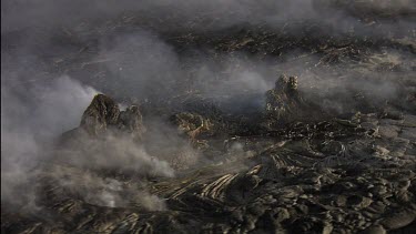 Active lava field . Day. Steam plumes.