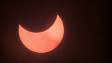 Time lapse dark clouds moving in front of partial solar eclipse, Israel 2011