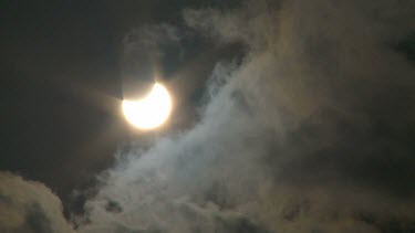 Time lapse dark clouds moving in front of partial solar eclipse, Israel 2011