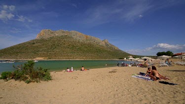 Woman Sunbathing At Stavros Beach & Lagoon, Stavros, Crete, Greece, Europe