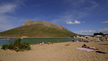 Woman Sunbathing At Stavros Beach & Lagoon, Stavros, Crete, Greece, Europe