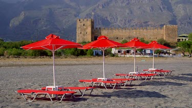 Red Sun Beds, Parasols, Castle & Mountains, Frangokastello, Crete, Greece