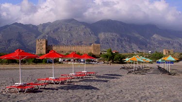 Red Sun Beds, Parasols, Castle & Mountains, Frangokastello, Crete, Greece