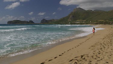 Teenage Girl On Beach In Pink Bikini, Falasarna, Crete, Greece