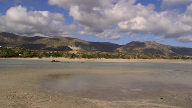 Teenage Girl Running On Beach In Blue Bikini, Elafonisi, Crete, Greece