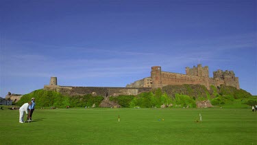 Croquet Being Played Infront Of Bamburgh Castle, Northumberland, England