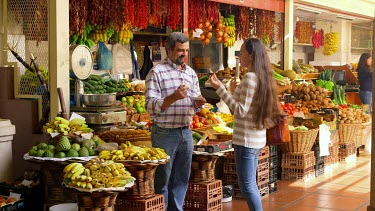 Customer Tries Fruits, Funchal Market, Madeira, Portugal