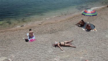 People Sunbathing On Beach, Balaklava, Criema, Ukraine
