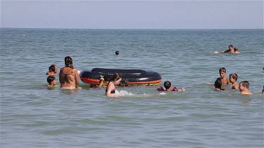 Children Playing In Adriatic Sea, Lido, Venice, Italy