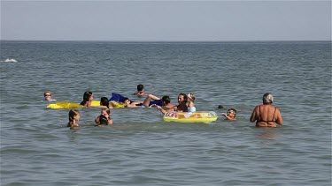 Children Playing In Adriatic Sea, Lido, Venice, Italy