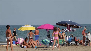 Mother & Daughter Playing Beach Tennis, Lido, Venice, Italy