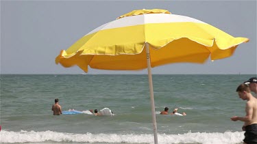 Yellow & White Parasol In Wind, Lido, Venice, Italy