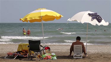 Yellow & White Parasols In Wind, Lido, Venice, Italy