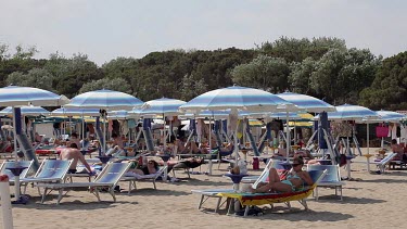 Sunbathers On Beach In Wind, Lido, Venice, Italy