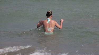 Lady Walks Into Sea In Bikini, Lido, Venice, Italy