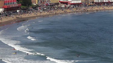 Canoeists & Surfers At South Bay, Scarborough, North Yorkshire, England