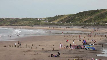 Holiday Makers On Beach, Sandsend, North Yorkshire, England