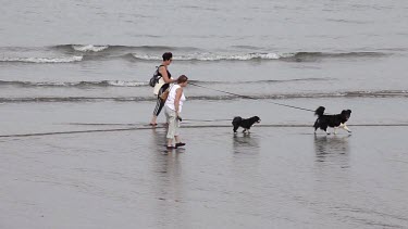 Two Ladies Walking Dogs, Sandsend, North Yorkshire, England